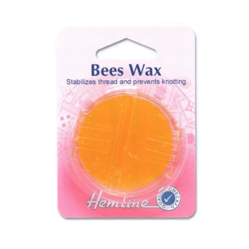 Hemline's beeswax and holder are packaged in their original carded packing. By simply sliding the thread through the groove in the plastic holder to coat it with beeswax, this tool strengthens strands and avoids twisting and knotting when hand sewing.