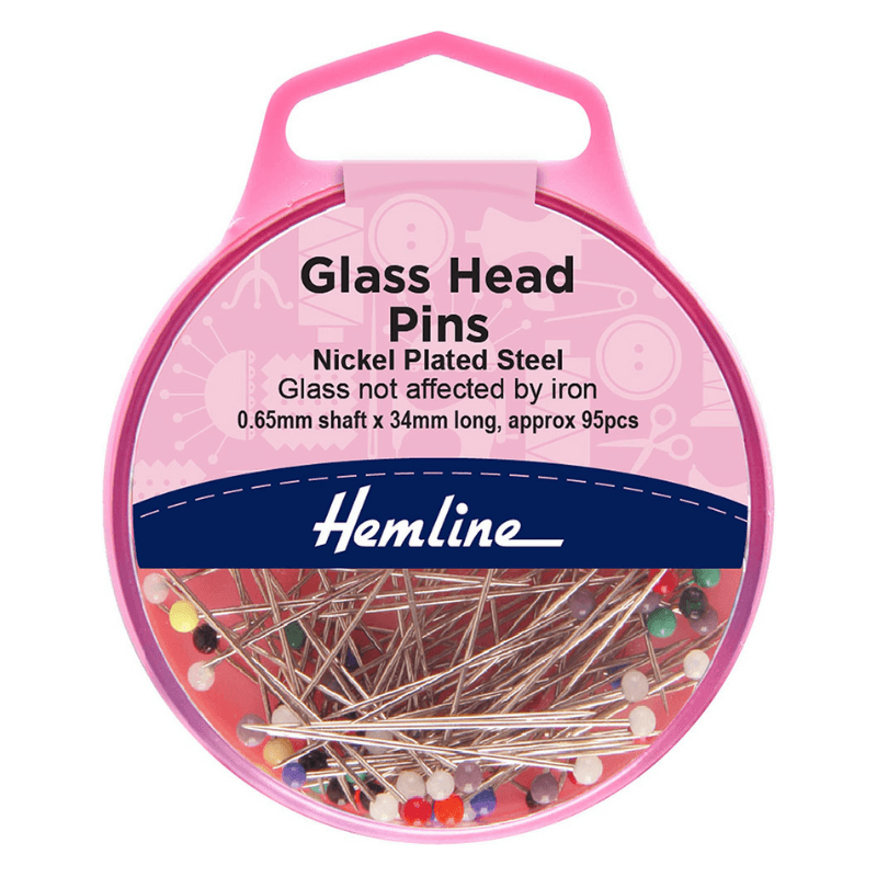 Approximately 95 nickel-plated steel 34mm Glass Head Pins in a pack.  Carefully poke pins through the cloth to keep it in place while cutting or sewing it, avoiding the use of a hot iron. Coloured pinheads are useful for marking different portions of the fabric.