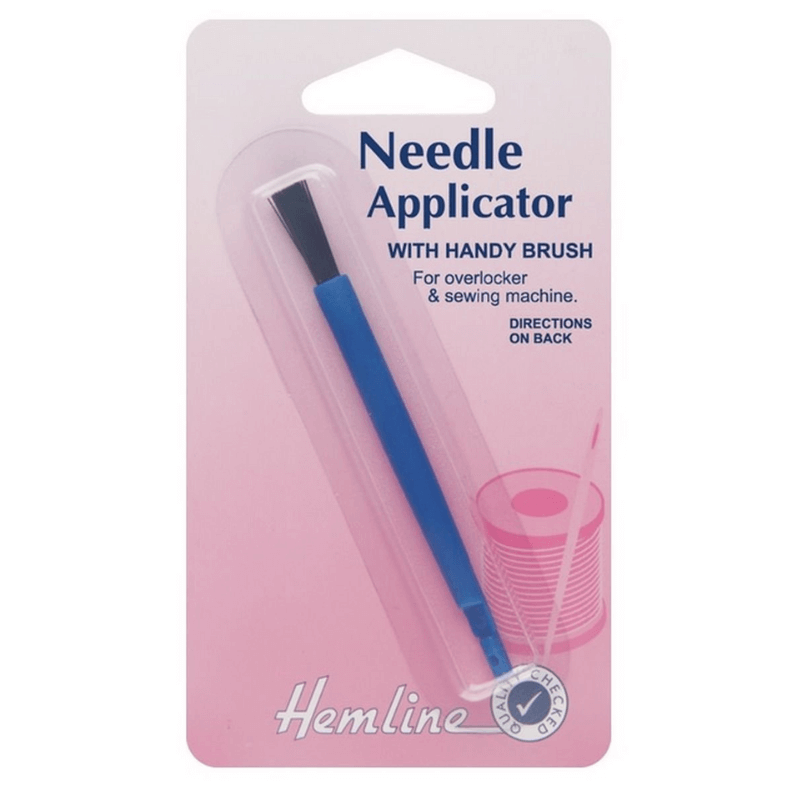This tool's grip keeps a sewing machine needle vertical and steady, making changing needles considerably easier.  Use the handy brush for cleaning the machine.
