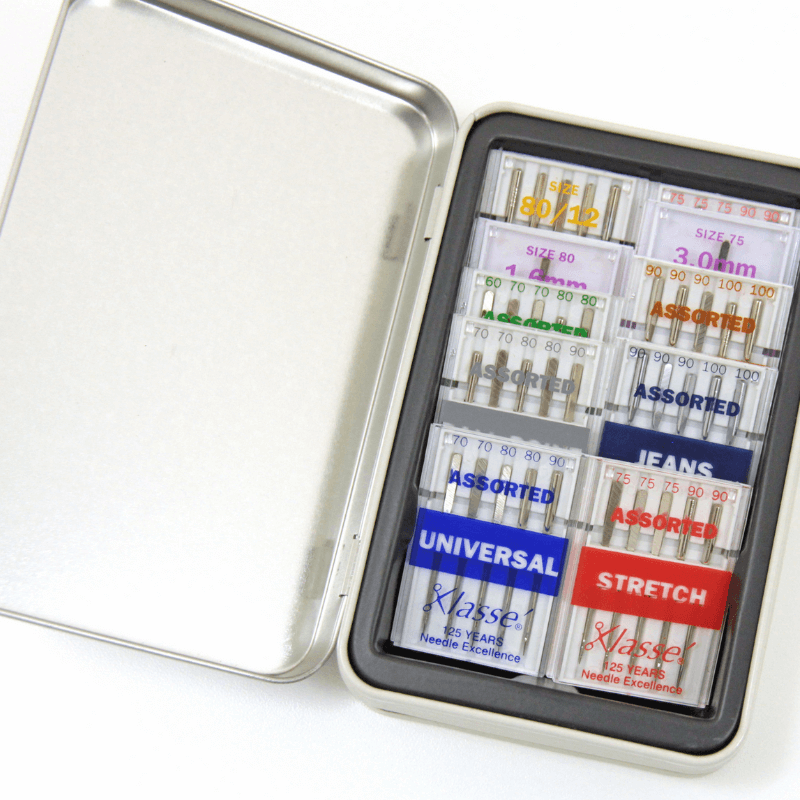 A high-quality Klasse needle pack in a tin box. It stores and organizes all ten needle packs. Universal, Stretch, Ballpoint, Jeans, Sharps, Leather, Metallic, Embroidery, Twin Universal, and Twin Embroidery needles are among the several types of needles available.